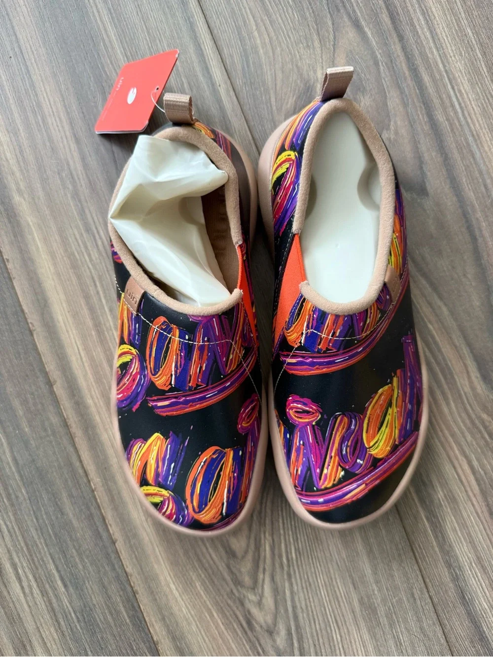 UIN Black Slip-On Shoes with Orange and Purple Swirl